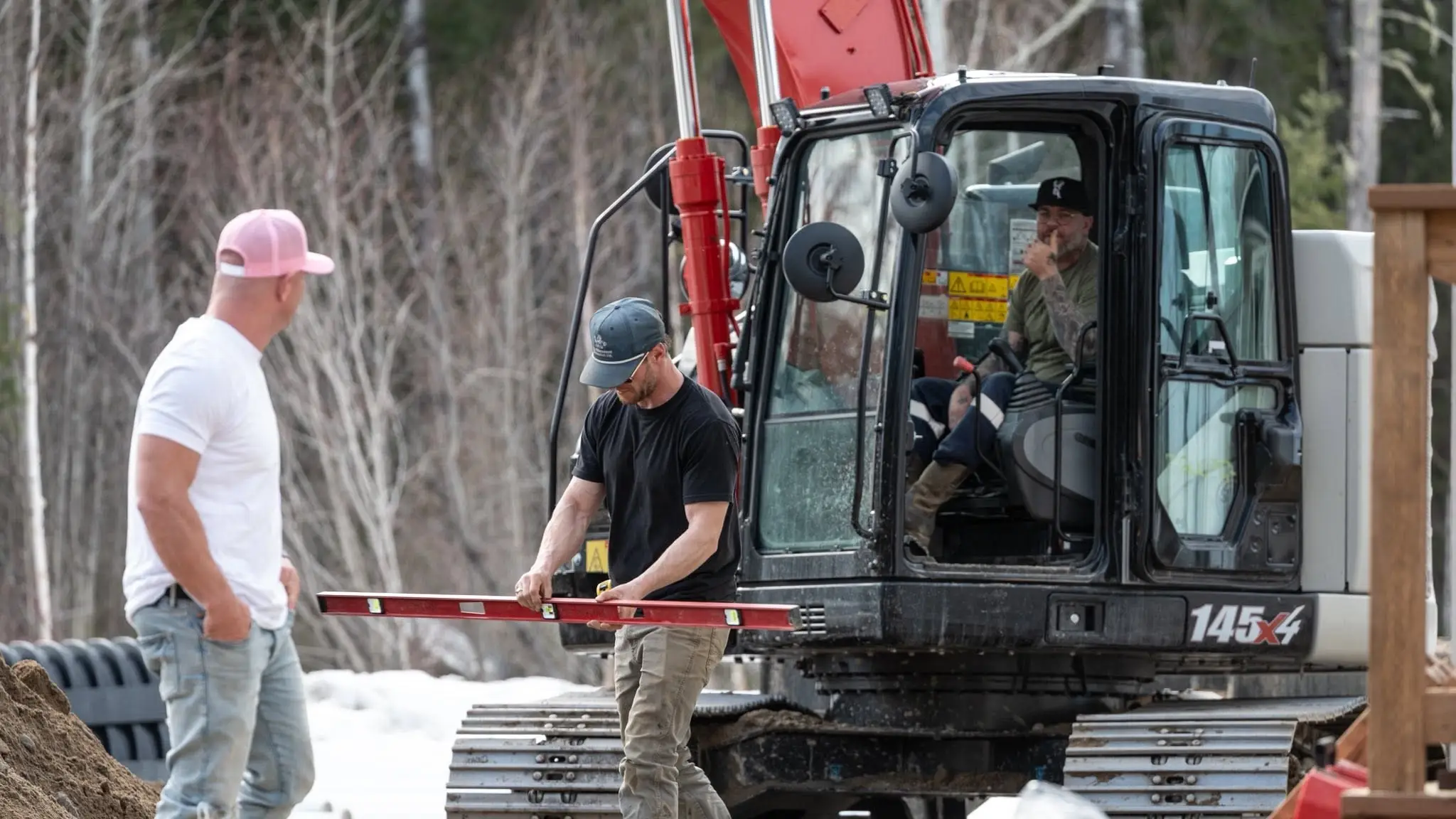 Three crew members working a site together