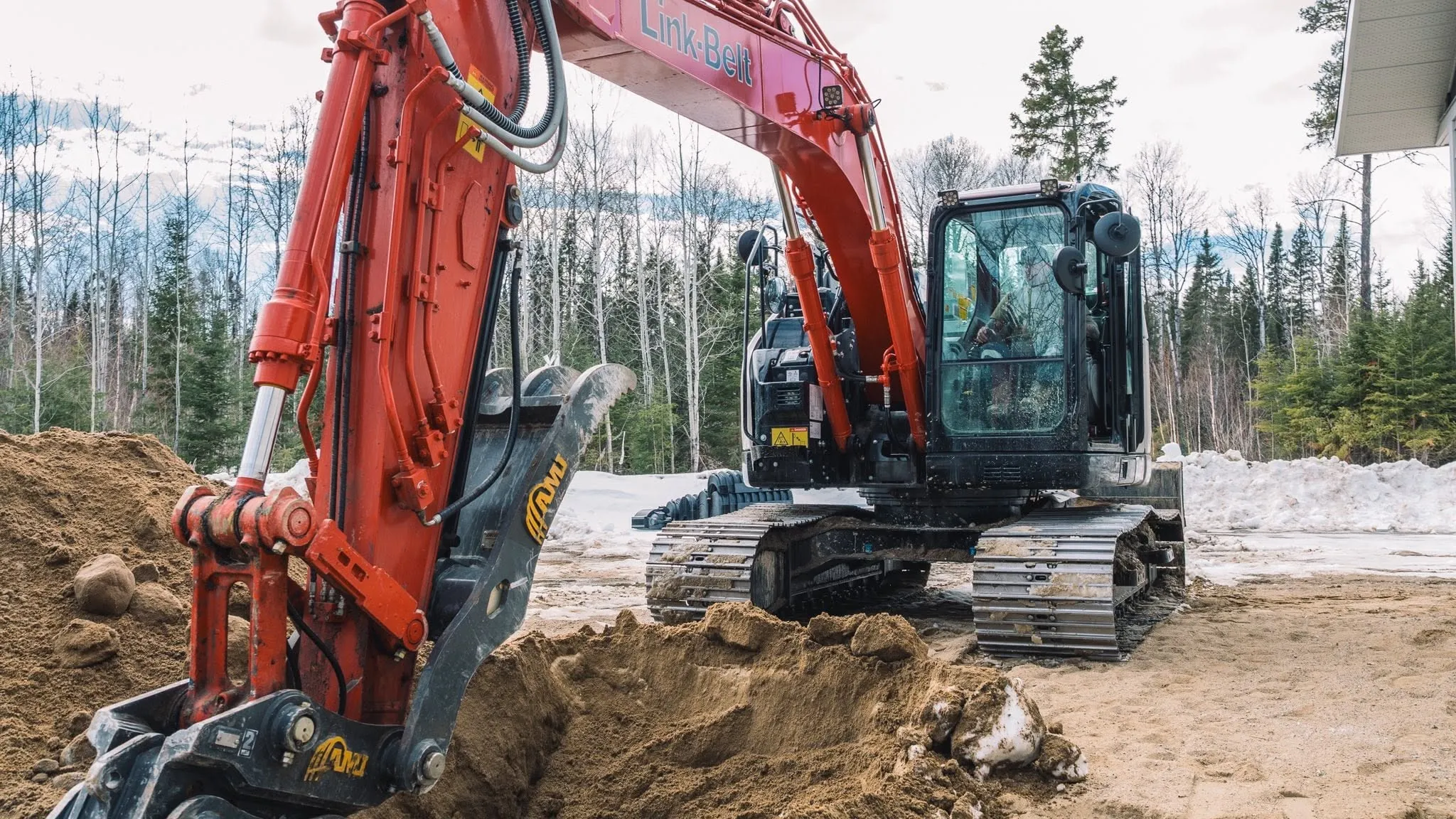 An excavator at work on a site for a Rega client