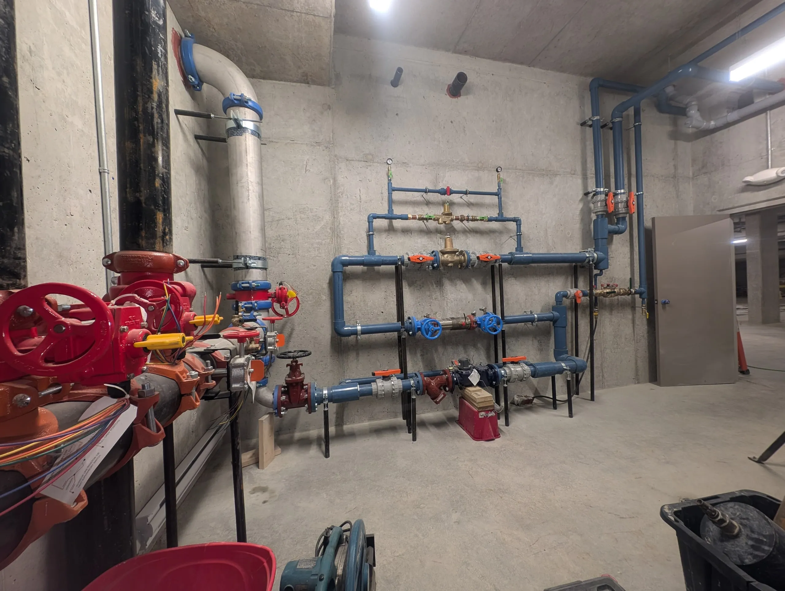 A finished mechanical and plumbing room, installed by a Rega client